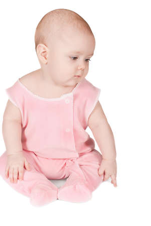 Cute sitting baby on a white backgroundの写真素材