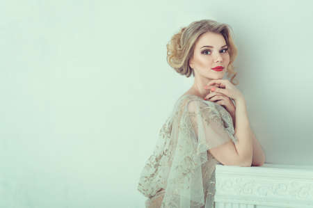 Beautiful bride in wedding dress. Portrait of young bride. Studio shot.の写真素材