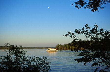 Boat at Sunset and Moonriseの写真素材