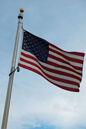 United States Flag being blown by the windの写真素材