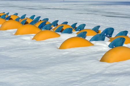Pedal boats in winter after a snowstormの写真素材