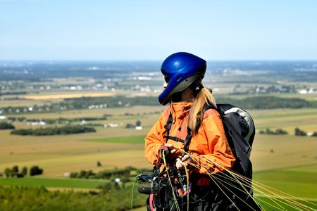 Paraglider ready to jump and waiting for the windの写真素材
