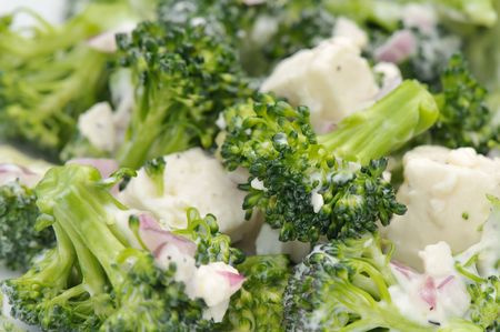 Macro of a broccoli and feta salad with shallots and salad dressingの写真素材