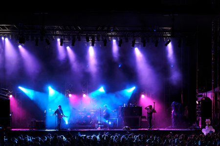 Rock concert on stage outside silhouette of singers on stage のeditorial素材