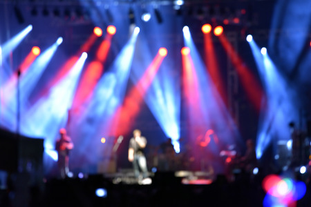 Outdoor rock concert with light background illuminationの写真素材