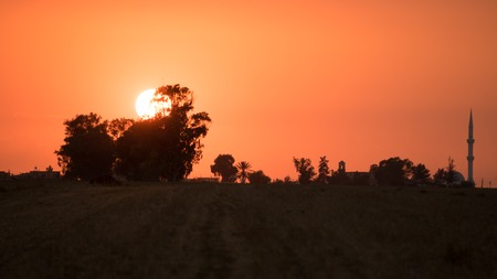 Village and field landscape at sunsetの写真素材