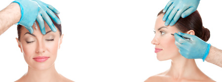 Facial cosmetic plastic surgery concept. Doctor surgeon hand in glove draw wrinkle lines on Woman  and injecting filler in forehead face eye isolated white background. Sculpting reshaping surgeryの写真素材