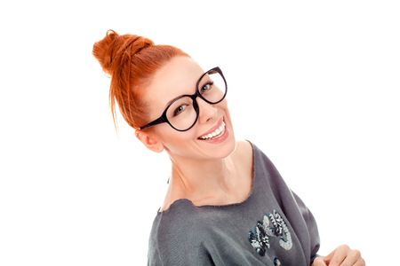 Closeup portrait of only one beautiful woman in her 30s wearing casual gray blouse looking happy smiling at you camera standing posing on pure white background wall. Mixed race irish, hispanic modelの写真素材