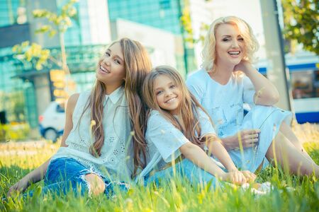 Happy Family photo. Closeup portrait photo toothy smiling two cute girls, her mother three members...