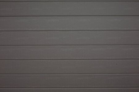 Gray plastic planks imitating wood wall pattern background