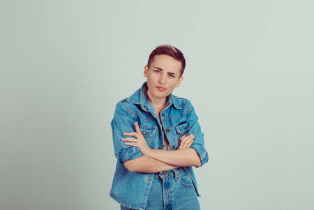 doubtful success short hair woman casual jeans clothes isolated on green grey white background with...