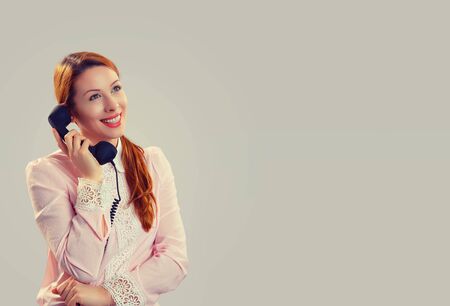 Happy woman in glasses speaking on telephone smiling looking to the side copyspace. Caucasian...