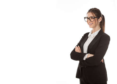 Closeup cutout side profile portrait of a beautiful woman Smiling Pretty Businesswoman With Arms Crossed, Confident girl wearing formal black suit, eyeglasses, white shirt isolated on a pure white backgroundの写真素材