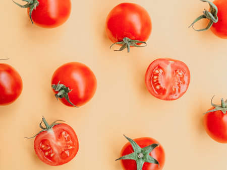 Healthy and dieting concept. Red tomatoes isolated on yellow color studio background with copy space. Flat lay, view from top.の写真素材
