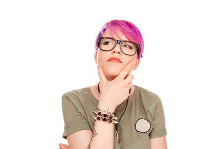 Portrait puzzled pensive woman thinking worried finger on chin gesture looking up to side...