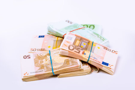 Euro. Money. Stack pile of European union currency bills, euro banknotes. Financial reward, savings, lottery win, payment, bank account concept. Finances, liquidity conceptual imageの写真素材