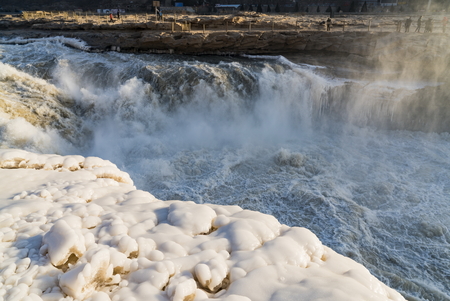 Yichuan County, Shaanxi Province, Chinese, Hukou Waterfall is the world's largest yellow falls. Into the winter, gradually formed yellow icefall, spectacular.の写真素材