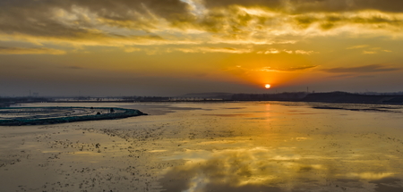 sun rises from the east of the river.の写真素材