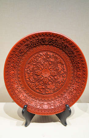 China, Henan Province, Kaifeng City, Kaifeng Museum, collection of cultural relics, Qing Dynasty, red lacquer goulian eight-treasure flower discのeditorial素材