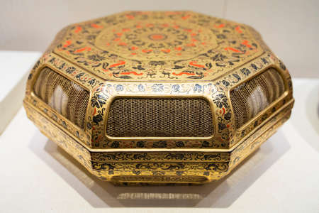 gold lacquer painted colorful Fushou flower and fruit hollow box from Qing Dynasty at Kaifeng Museum, Kaifeng City, Henan Province, China.のeditorial素材