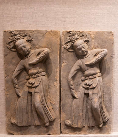 ceramic tiles with relief dancing figures from Song Dynasty at Kaifeng Museum, Kaifeng City, Henan Province, China.のeditorial素材