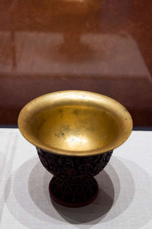 China, Hebei Province, Chengde City, Chengde Museum, Collection of Cultural Relics, Qing Dynasty, Red Carving Lacquer Sanskrit Target Bowlのeditorial素材