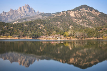 Landscape view of a beautiful lake with mountains reflected in the waterの写真素材