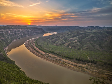 Aerial view of the river and the mountains at sunset. Natural landscape.の写真素材