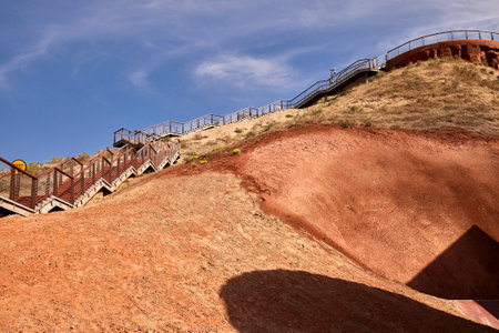 Staircase to the top of the mountain with blue sky.の写真素材
