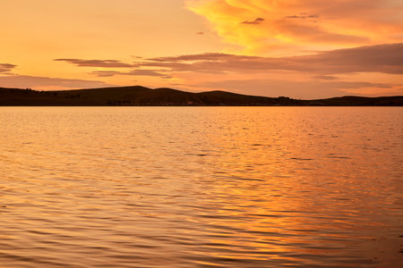 Beautiful sunset on the lake. Summer landscape. Sunset on the lake.の写真素材