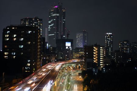 Skyline of Tokyo with cars rushing byの写真素材