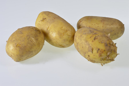 Potatoes under the white backgroundの写真素材