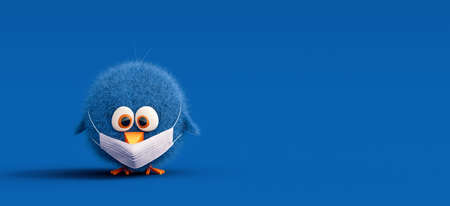 Small sad chicken wearing medical mask on blueの写真素材