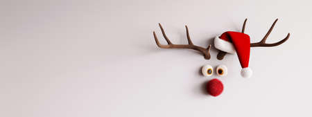 Christmas deer head with red Santa hat on white background, copy space.の写真素材