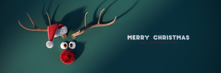 Cute funny reindeer with red nose and Merry Christmas text on green background 3D Rendering, 3D Illustrationの写真素材