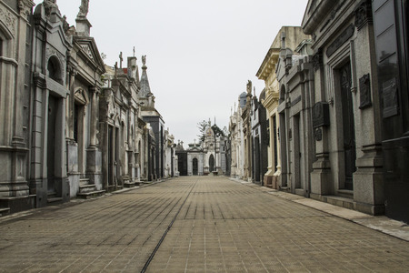internal streets of Recoleta Cemetery in Buenos Aires. On the sides of the path we see the vaults where are the dead.のeditorial素材
