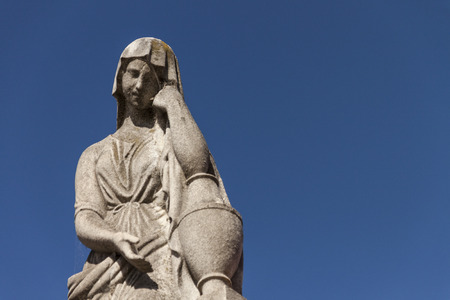 Christian woman statue in the cemeteryの写真素材