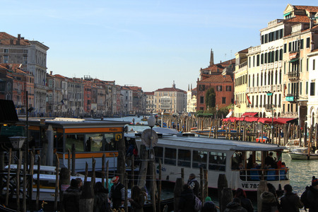 The Grand Canal of Venice and buildings. Gondolas, boats and small boats all day crossing from one coast to anotherのeditorial素材