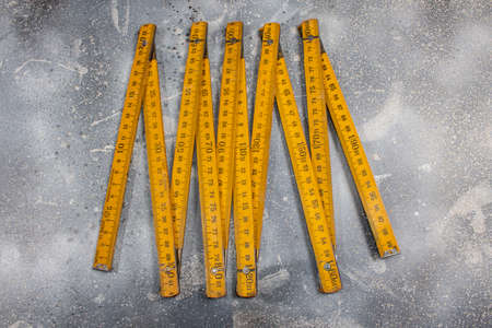 close up of a carpentry ruler on rustic backgroundの写真素材