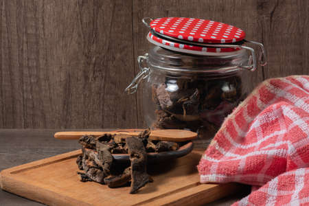 dry mushrooms on an oak boardの写真素材