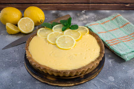 Fresh and homemade lemon pie on rustic backgroundの写真素材
