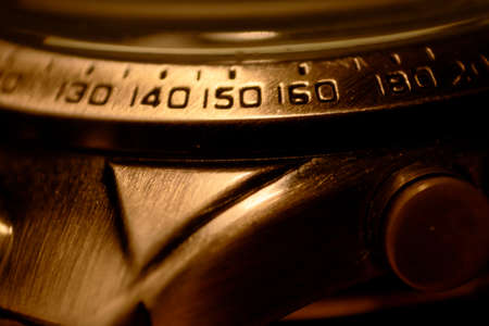 Close-up of the numbers on the outer ring of a watch. Selective focus, shallow depth of field.の写真素材