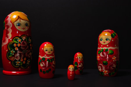 Set of five matryoshka russian nesting dolls with black background.の写真素材