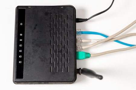 Network cable connects to wireless router, router, internet, global network, comunications.