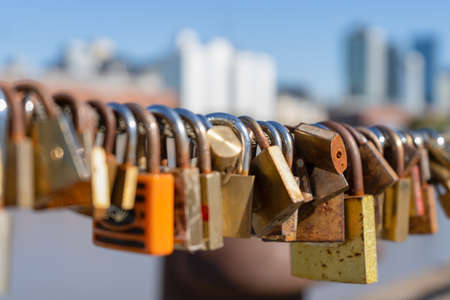 Padlocks hanging near the Puente de la Mujer in Buenos Aires, Argentina.