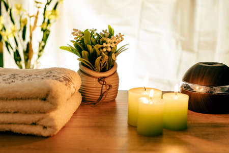 Towels, candles and humidifiers for relaxation and massage treatments.