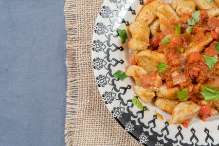 Homemade Italian Gnocchi with Red Sauce. Copy space.