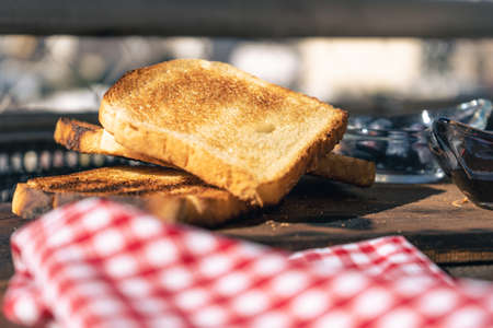 Normal view of a table with toasts, a pot with fresh aranadanos. Healthy and natural food concept.の写真素材