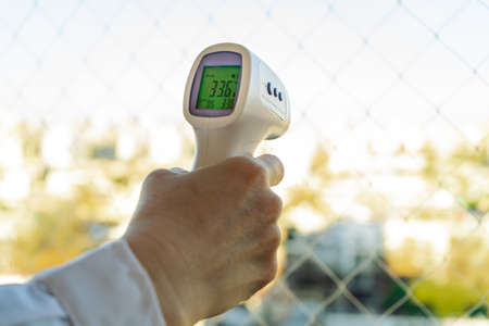 Digital Infrared Thermometer (thermometer gun) for check forehead temperature measurement screening from Coronavirus (COVID-19).の写真素材