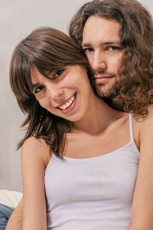 Portrait of a happy couple laughing at camera. Love, happyness, joyfull concept.の写真素材